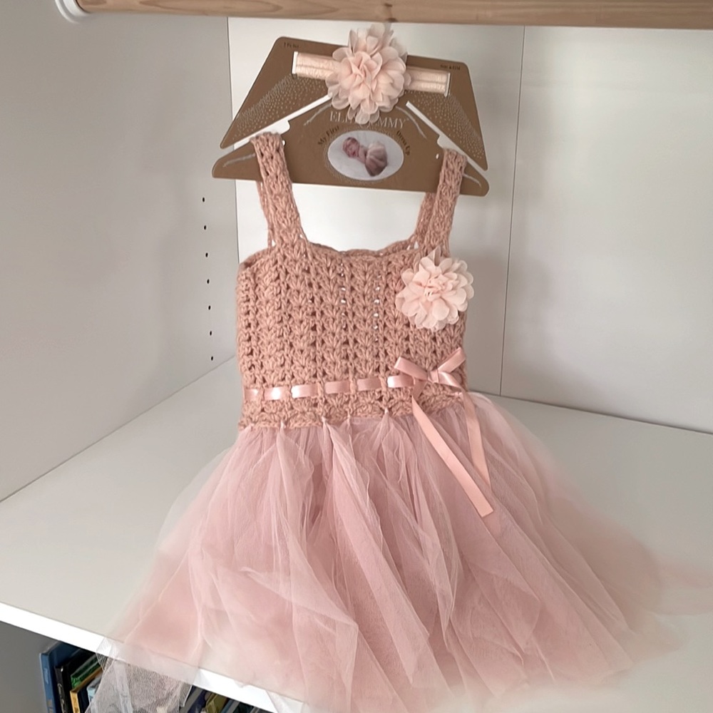 Cute pink dress with bow, perfect for baby pictures